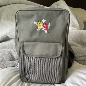 M&M'S | Official Merchandise | Army Green| Crossbody |Sling Backpack|Embroidered